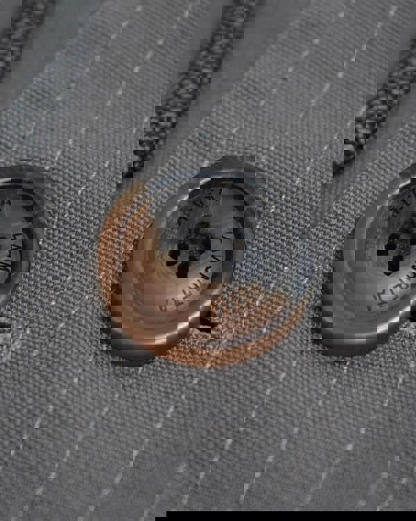 Lambretta Mens/Womens Carnaby Scooter Hooded Classic Mod Ska Badge Parka, close-up of the button on the gray fabric with stitched lining detail.