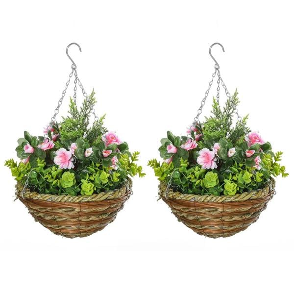 Set of two hanging rattan planters with pink flowers and green leaves