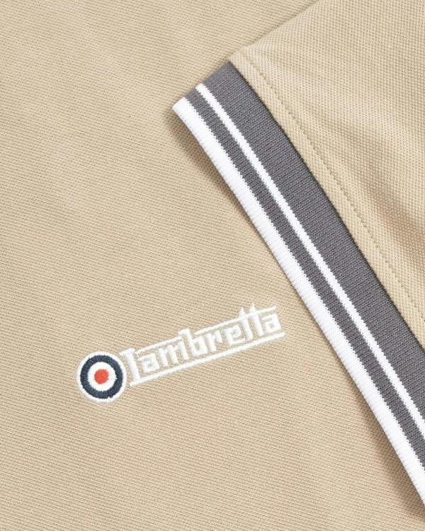 Lambretta Contrast Tipped Mens Mod Ska Casual Polo, close-up of the beige fabric with embroidered Lambretta logo and striped grey, white, and black trim on the collar.