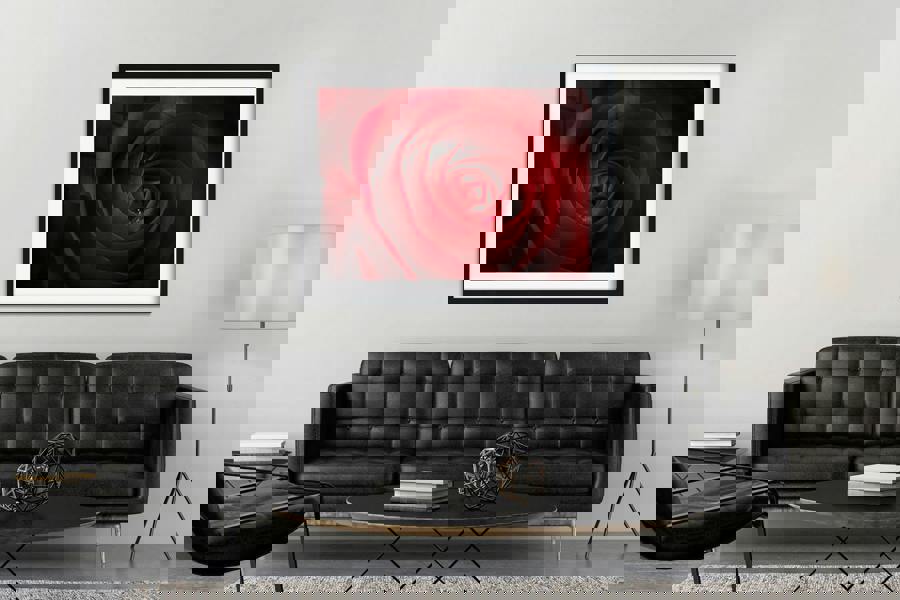 rose artwork print framed above a sofa