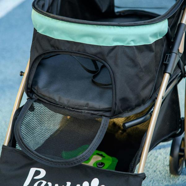 Black side storage pocket and mesh panel on green-and-black pet stroller