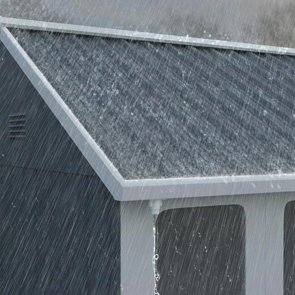 Close-up of dark grey galvanised roof edge and wall panel seams