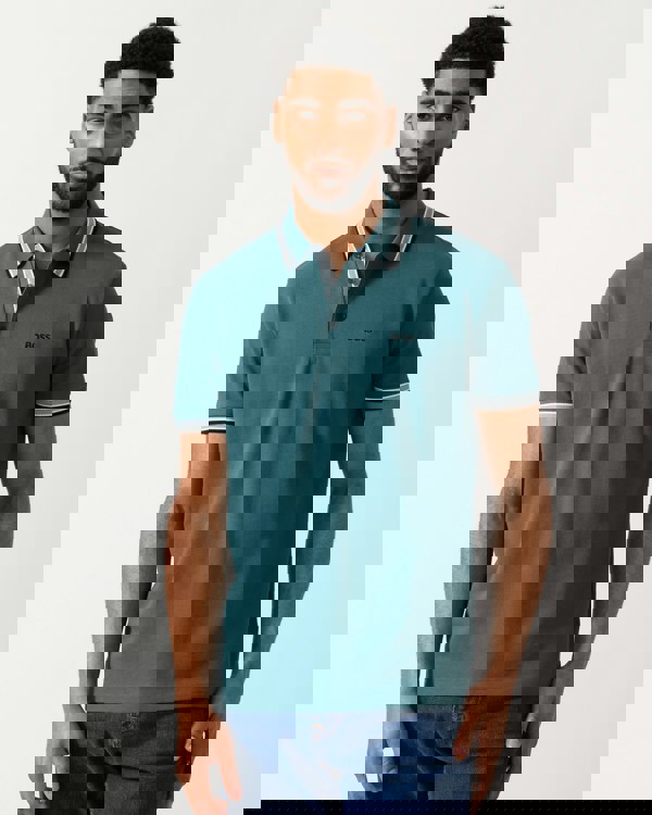 model wearing a BOSS Green Paddy Mens Cotton-Piqué Polo Shirt with Contrast Logo in Open Green