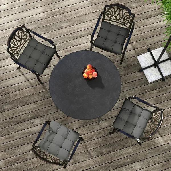 Charcoal gray seat cushion set with ties, quilted square pads arranged on deck
