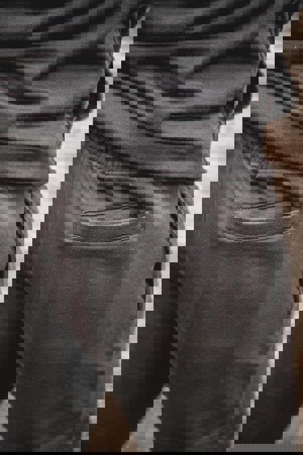 WorkTough Mens Cargo Stretch Fit Cordura Work Trouser Fleece Jogger, close-up of black fabric pocket on the pants.