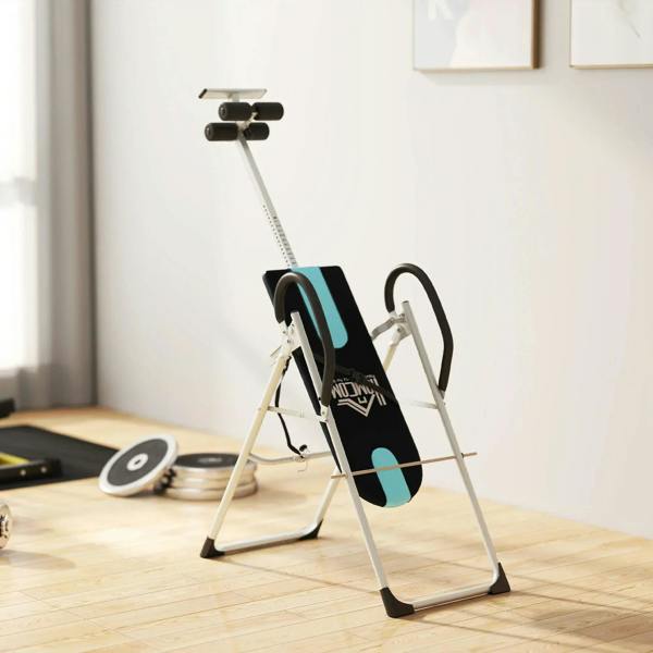 Foldable inversion table in upright position with black-and-blue backrest pad and handles