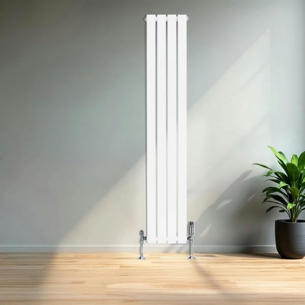 Sleek white flat single column radiator, 1600 x 280mm, mounted on a wall with chrome valves, surrounded by natural light and greenery
