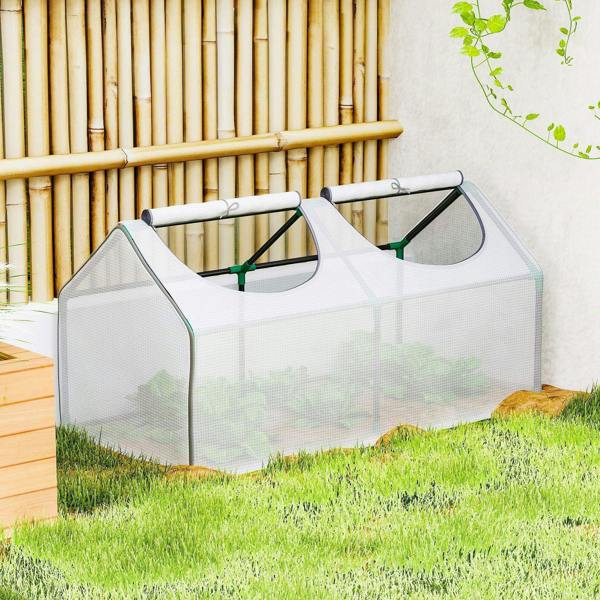 White portable mini greenhouse with mesh walls and arched support bars