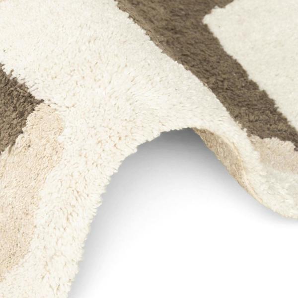 Close-up of a textured rug with beige and brown stripes on a white background
