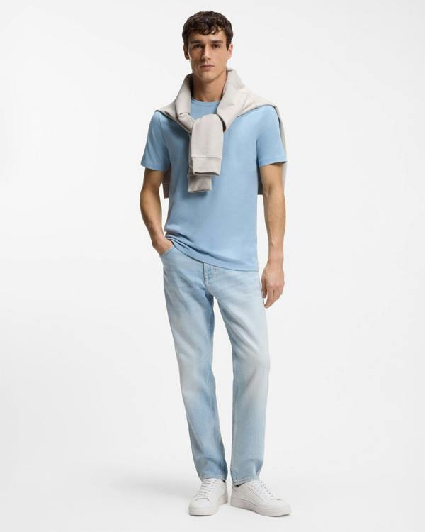 Model wearing BOSS Orange Tales Mens Cotton-Jersey T-shirt With Logo Patch - Light/Pastel Blue 458 - Full length