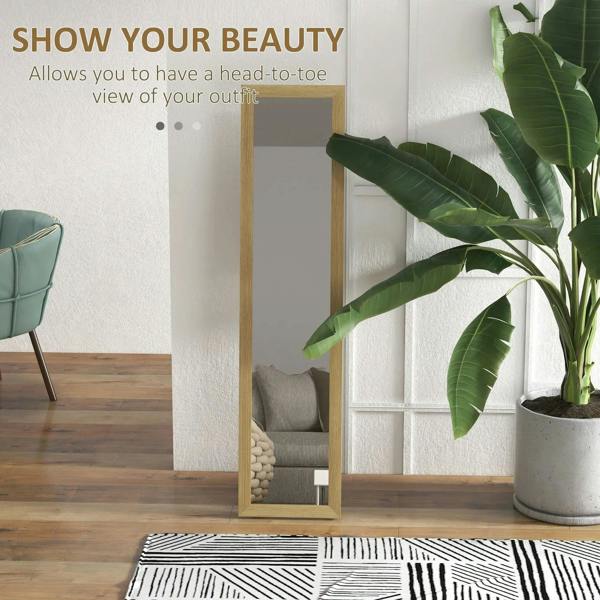 Full-length mirror with light natural wood frame, leaning against wall