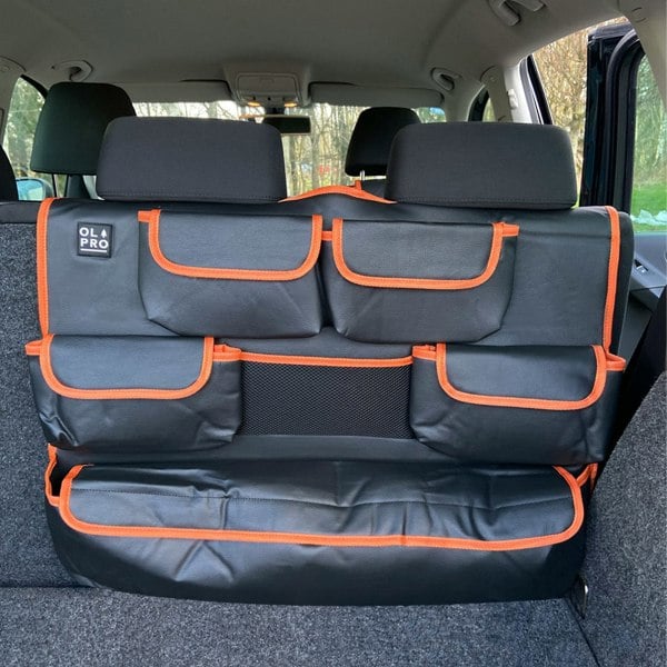 The OLPRO Rear Double Seat Storage Organiser in Orange that is empty and attached to the back of the rear seats of a VW vehicle.