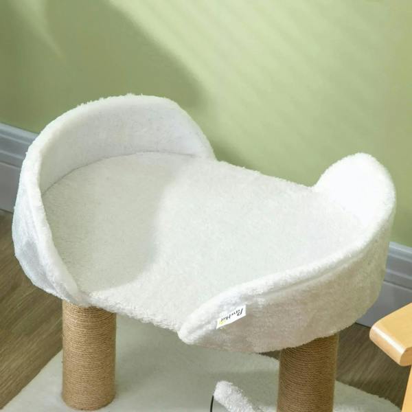 Close-up of white plush cat tree perch on jute post with hanging ball