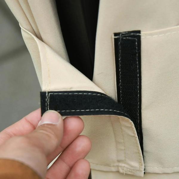 Beige curtain strap with Velcro closure attachment, shown in close-up
