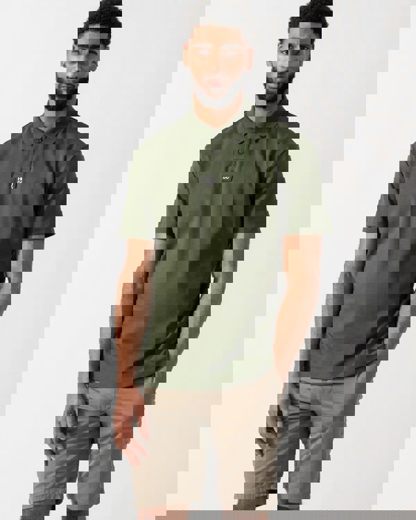 model wearing a HUGO Deabono Mens Interlock Cotton Polo Shirt with Stacked Logo in Dark Green