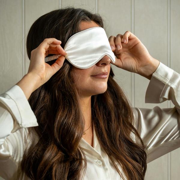Ivory Pure Mulberry Silk Eye Mask styled in a bedroom | Soak and Sleep