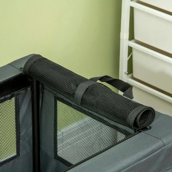 Grey pet carrier with rolled cover on top and mesh window panels