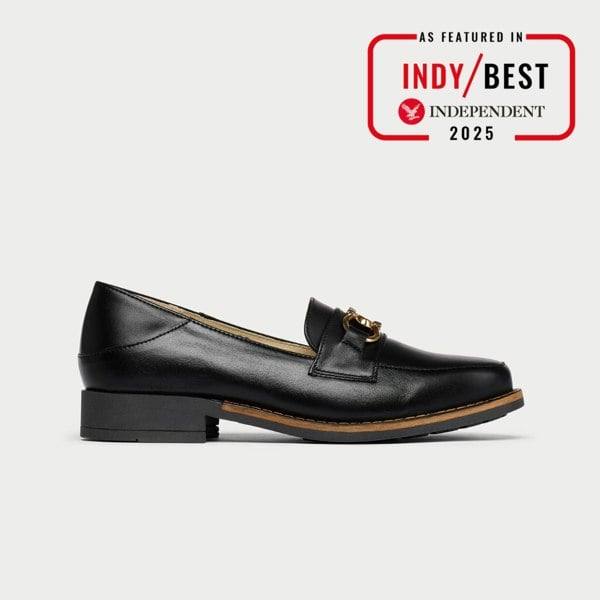 Black leather loafer with gold buckle on a white background, featuring Indy Best Independent 2025 badge.