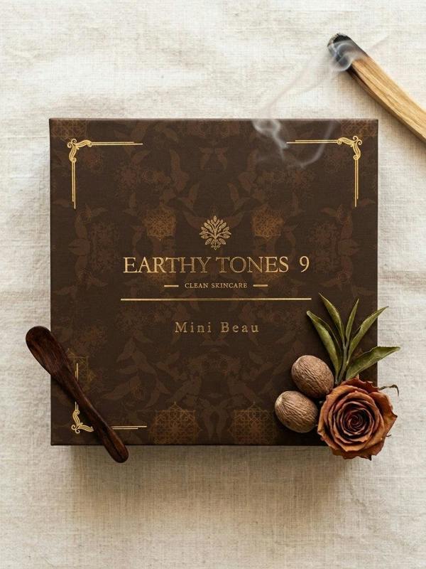 Brown skincare product gift box labelled 'Earthy Tones 9' with decorative elements on a light background.