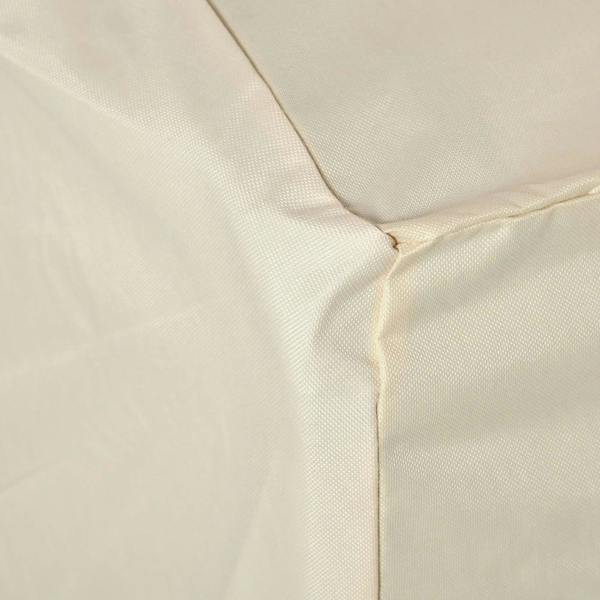 Beige sofa cover corner seam with stitched edges and textured woven fabric