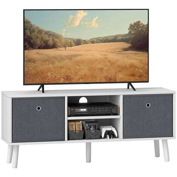 White TV cabinet with two grey drawers and open media shelf under a flat-screen TV