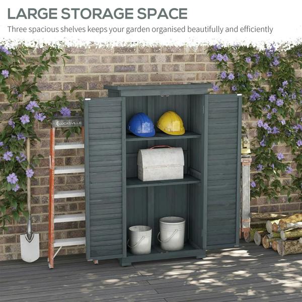 Grey garden shed with open doors and shelves, storing bins and bags inside.