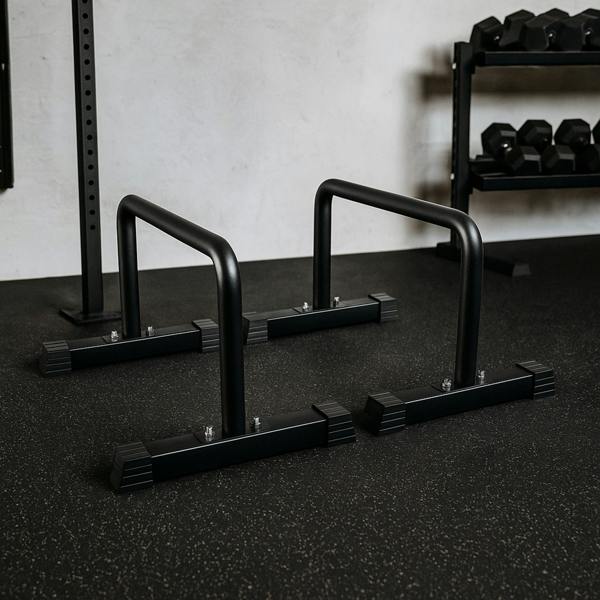 Large parallettes in matte black finish, featuring sturdy metal construction and non-slip rubber feet, ideal for bodyweight exercises