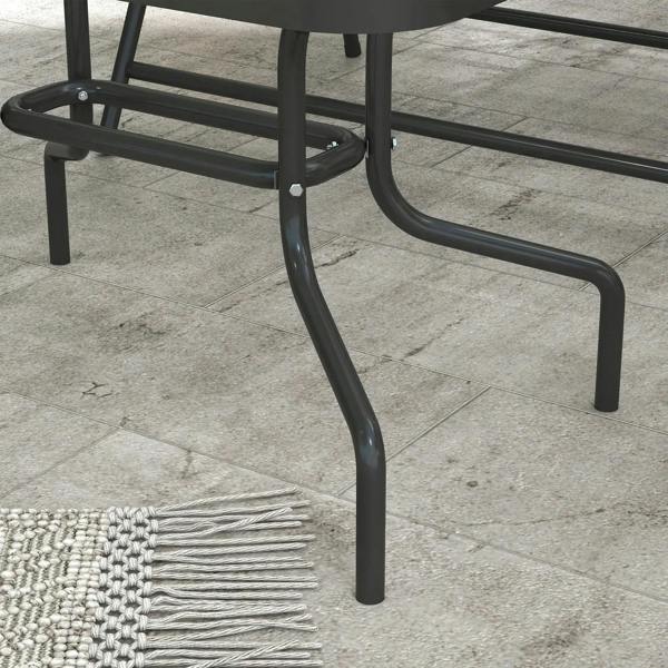 Dark metal armrest and curved frame legs with foot caps