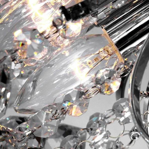 Close-up of clear crystal pendants with prismatic sparkle and chrome hardware