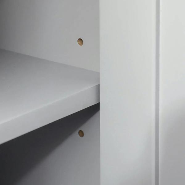 Grey cabinet interior side panel with shelf positioning holes and open storage area