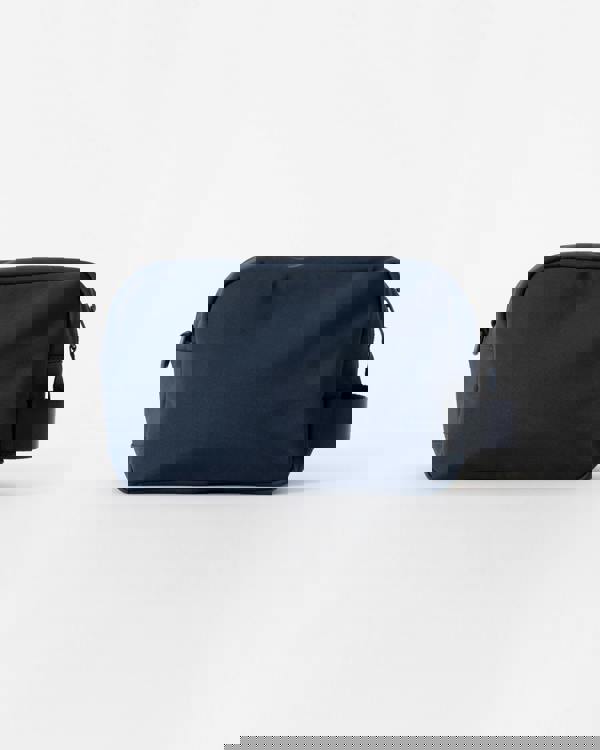 Navy blue toiletry bag on a white background