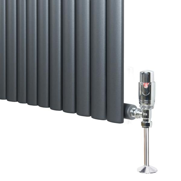Oval single column radiator in anthracite grey, featuring sleek vertical panels and a chrome valve for modern heating solutions