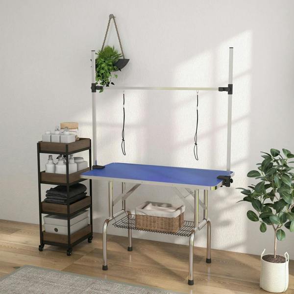 Blue rubber-top pet grooming table with under wire basket and side hanging loops
