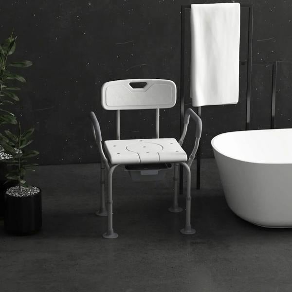 White shower stool with arms and backrest, padded seat with commode bucket opening