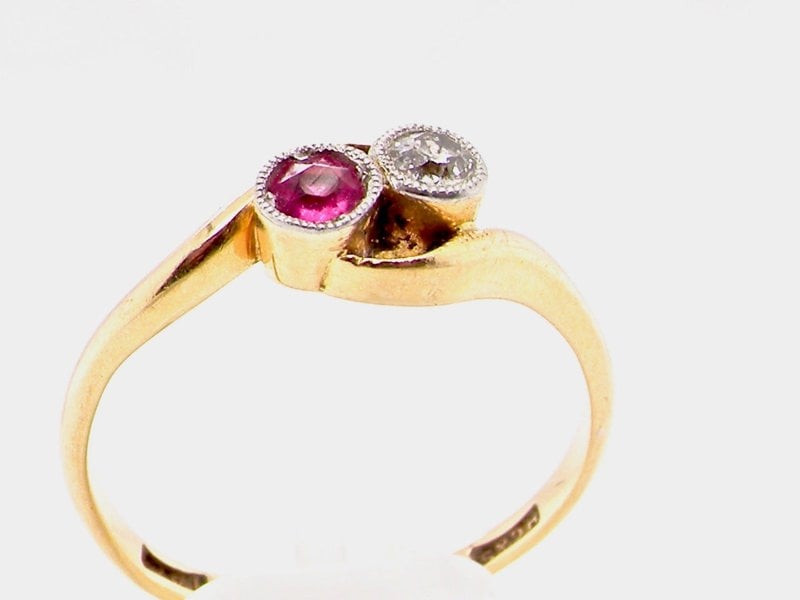 Vintage Tom A vintage two stone ruby and diamond cross over ring