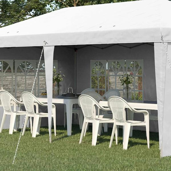 White pop-up gazebo interior with sidewalls, window panels, and dining table chairs
