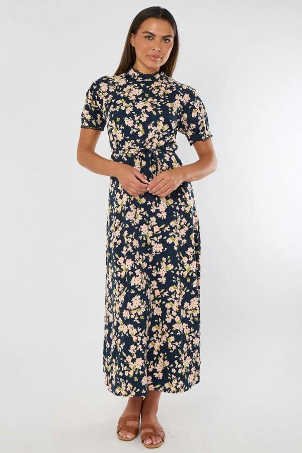 Woman wearing a floral dress on a white background