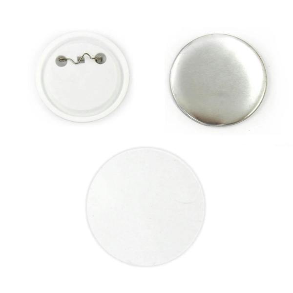 Metal and white plastic badge components, including a shiny silver pin back, blank white front, and circular shape for custom designs