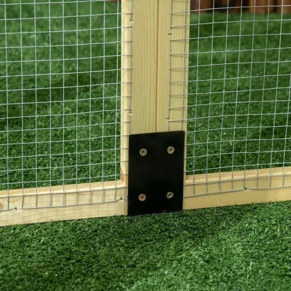 Close-up of wooden chicken run latch hardware on wire mesh side panel