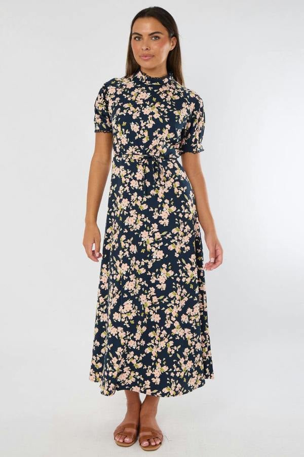 Woman wearing a floral dress on a white background