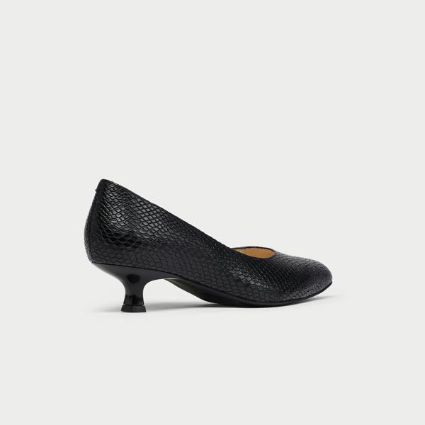 Black heeled shoe on a white background