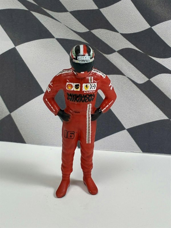 a toy figure of a race car driver