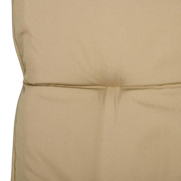 Close-up of beige cushion with visible stitching seam on seat back
