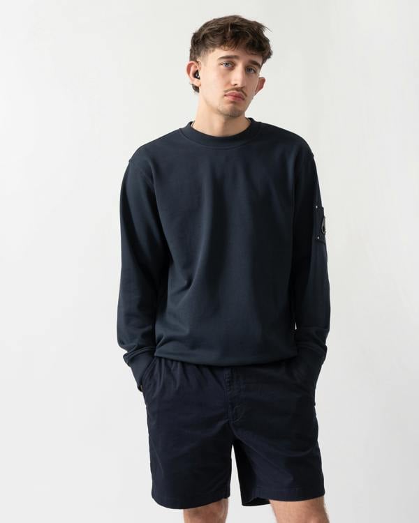 studio shot of a model wearing a Moose Knuckles Hartsfield Mens Crew Neck Sweatshirt in Navy 833