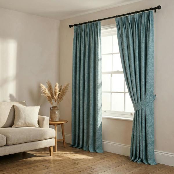 Malaga made-to-measure curtains in Aegean, styled in a living room