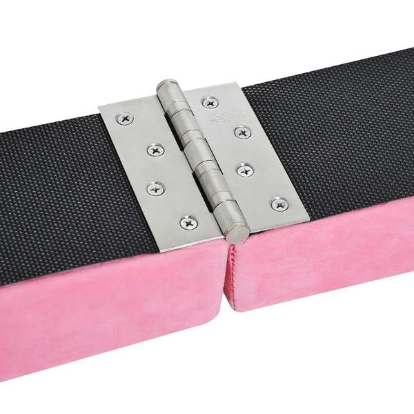 Pink balance beam folding hinge with metal bracket connecting foam sections.