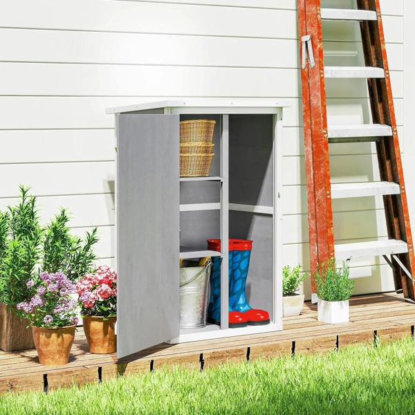 Grey wooden small shed with open door and shelves, storing buckets and boots