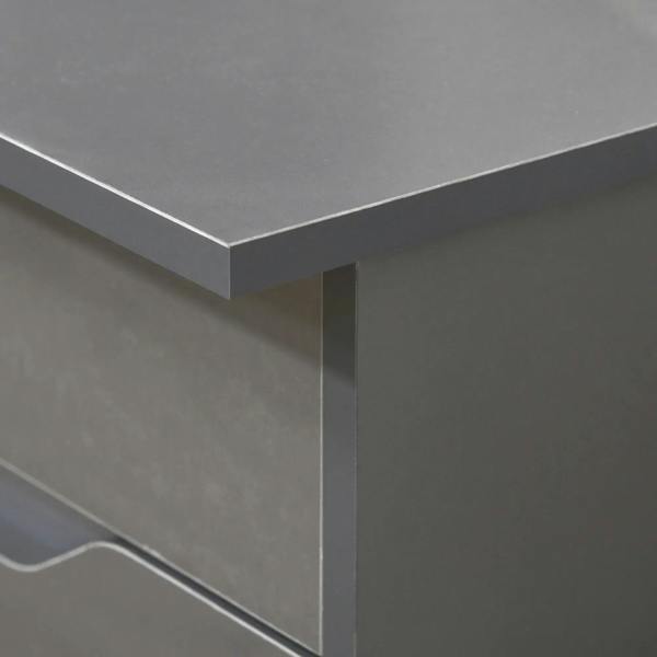 Grey desk corner with smooth tabletop edge and recessed drawer front