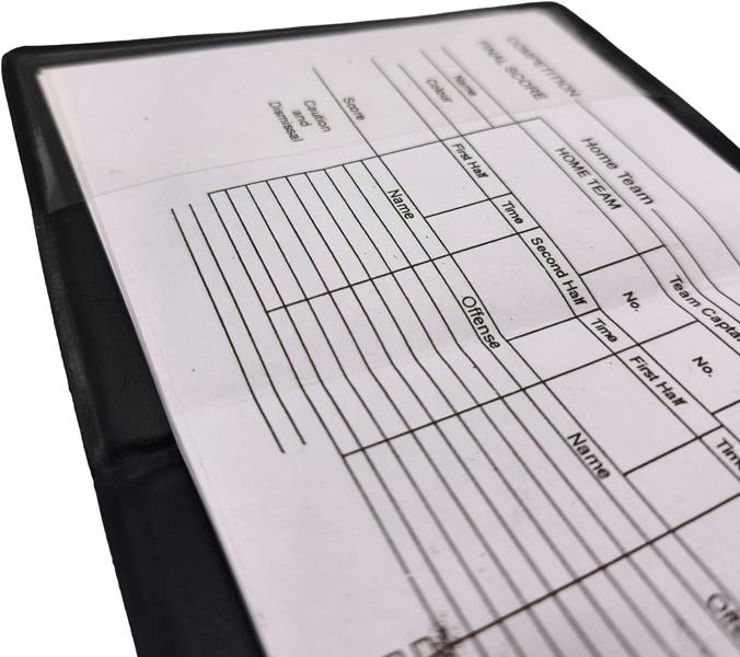 Close-up of referee match scorecard notepad grid inside clear wallet - Optimum