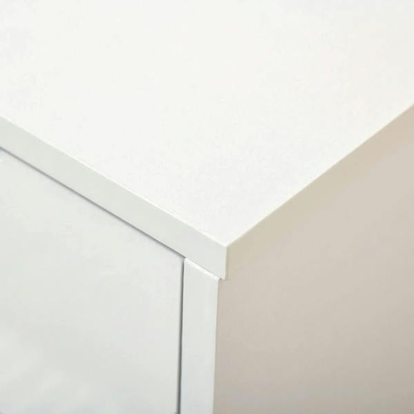 White cabinet top corner with smooth high-gloss finish and clean straight edge